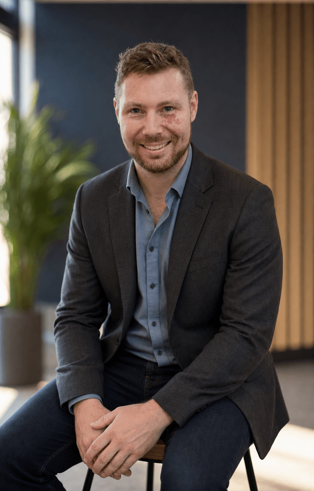 Kyle Payne seated in a modern office